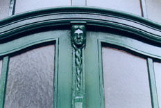 ["The Girl in the Door": photo of a carved figure of a girl
as part
of a Berlin doorway]